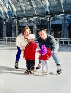 Whitney and Brian with their kids hockey skating