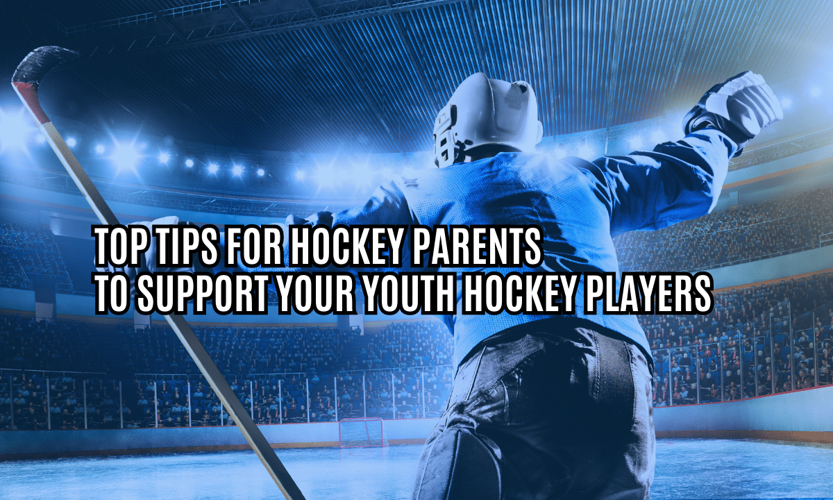 Youth Hockey Player holding hands up with hockey parents in the stands