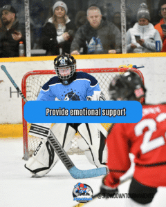 youth hockey goalie with a player shooting the puck and hockey parents looking on